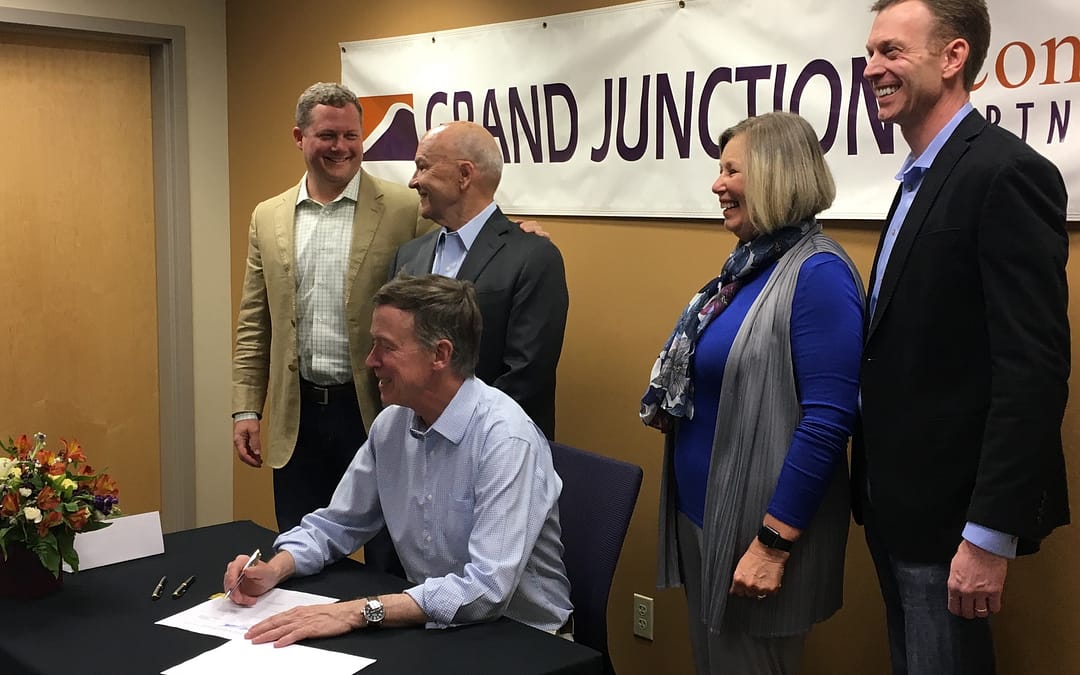 Gov. Hickenlooper signs a bill at GJEP, Grand Junction, CO